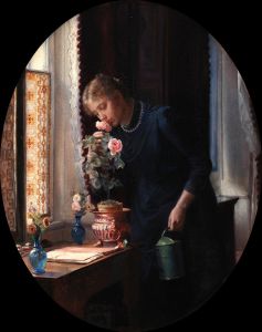 En ung pige, der lugter til en rose