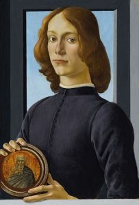 Portrait of a young man holding a roundel