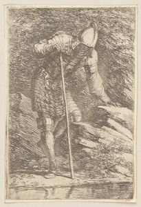 Soldier in Helmet and Armor Regarding a Stream