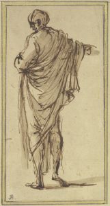 A man seen from the rear points to the right