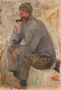 Sitting fisherman with a pipe