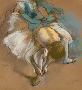 Danseuse attachant son chausson