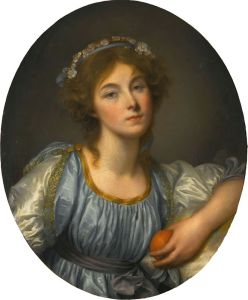 A Young Girl Holding An Orange