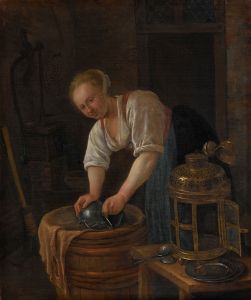 Woman scouring metalware