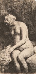 Woman bathing her feet at a brook