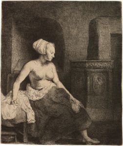 Woman sitting half dressed beside a Stove